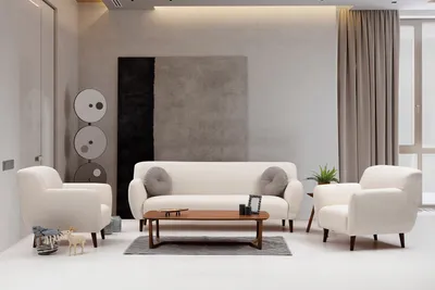 A living room scene with a sofa, armchair, and coffee table.