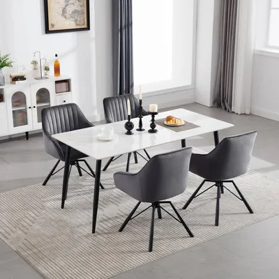 A dining room scene with a table and chairs.