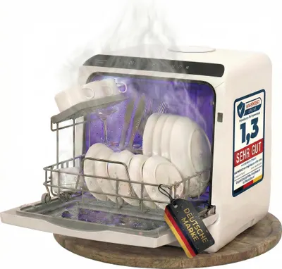 A compact dishwasher with its door open, showing dishes inside and steam rising.