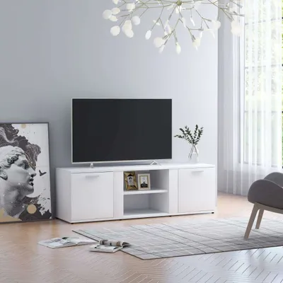 A white TV stand with a television on top, placed in a living room setting.