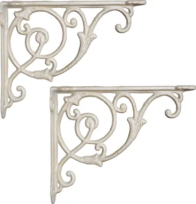 Two white ornate shelf brackets are shown against a white background.
