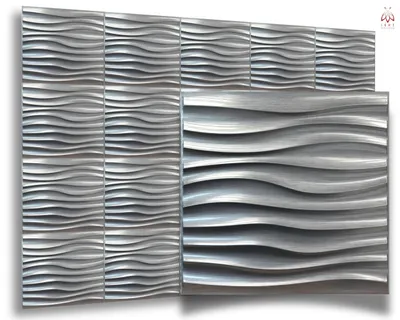 A display of silver-colored 3D wall panels with a wavy texture, arranged in a grid.