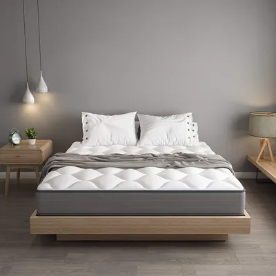 A mattress on a wooden bed frame in a bedroom setting.