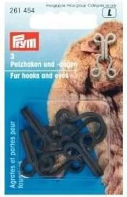 A package of fur hooks and eyes, with a sample of the product shown on a furry background.