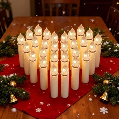 A table setting with Christmas decorations, including a red runner, pine branches, bells, and many LED candles.
