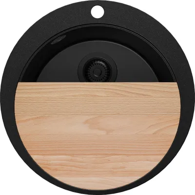 A top-down view of a black round sink with a wooden cutting board insert.