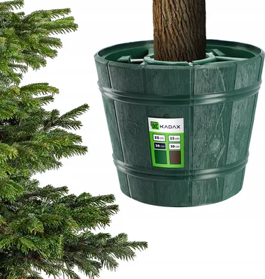 A green Christmas tree stand with a tree trunk inside, shown from the side.