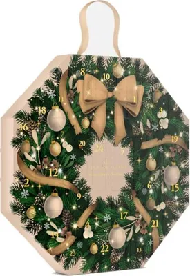 An advent calendar shaped like a Christmas wreath, decorated with ornaments and a bow.