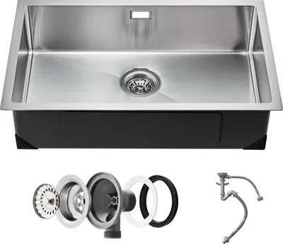 A stainless steel kitchen sink with its accessories laid out below.