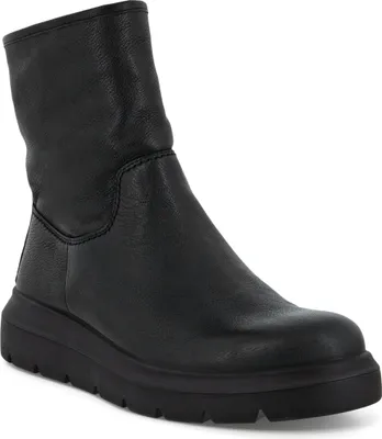 A black leather boot on a white background.