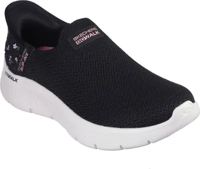 A black Skechers slip-on sneaker with a white sole, shown from the side.