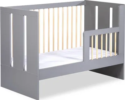 A gray children's bed with wooden slats and a white mattress.