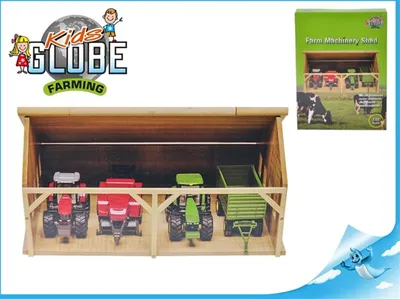 A wooden toy barn with toy tractors and a trailer inside, with a product box in the background.