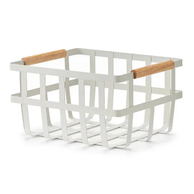 A white metal storage basket with wooden handles against a white background.