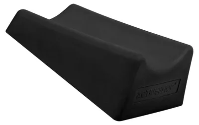 A black footrest for pedicures.