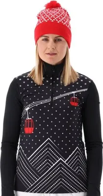 A woman wearing a ski sweater and hat.
