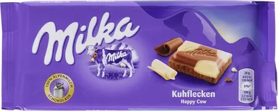 A package of Milka Happy Cow Kuhflecken chocolate.