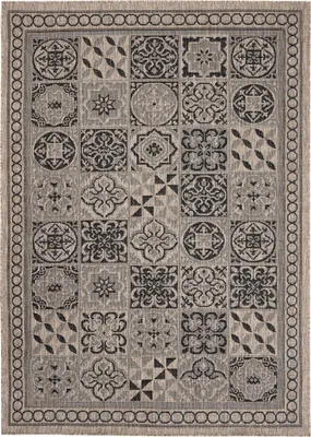 A flat lay of a rug with a geometric tile pattern.