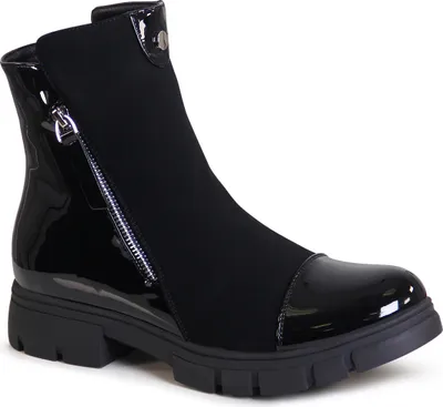 A studio shot of a single black ankle boot.
