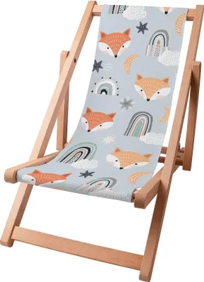 A wooden beach chair with a fabric seat featuring a pastel fox and rainbow pattern.