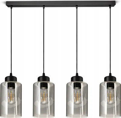 A product shot of a four-light pendant lamp with clear glass shades and black fixtures, set against a white background.