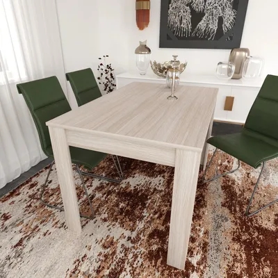 A dining table and chairs are set up in a dining room with a buffet in the background.