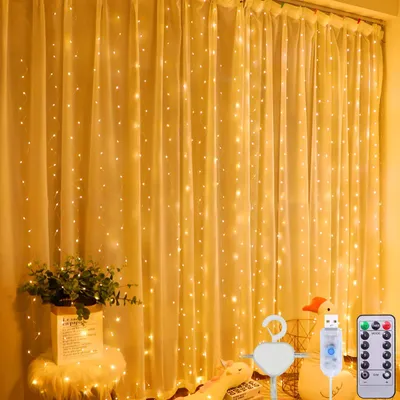 Imagen del producto de Cortina de luces blanco cálido, 3x3 metros | 300 LEDs | USB | Control remoto | 8 modos | Temporizador