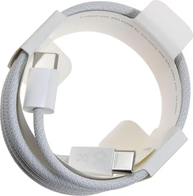 A white USB-C charging cable coiled and held by white cardboard packaging.