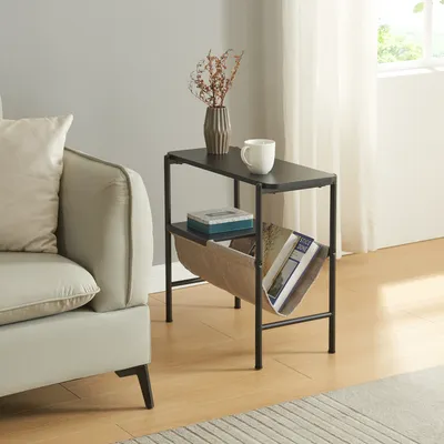 A side table next to a sofa in a living room setting.