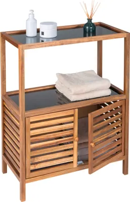 A wooden bathroom storage unit with glass shelves and slatted doors.