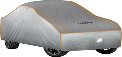 A car covered with a gray protective cover, shown from a front-side angle.
