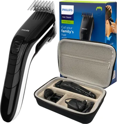 A Philips hair clipper set is displayed, including the clipper itself, a charging adapter, and accessories in a travel case, alongside its packaging box.