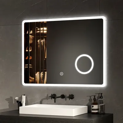 A modern bathroom vanity with a rectangular sink and a large LED mirror above it.