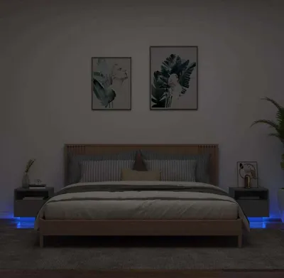 A bedroom scene with a bed, nightstands, and artwork.