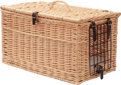 A wicker pet carrier with a metal grate on the side, shown against a white background.