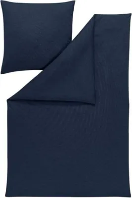 A folded dark blue duvet cover and a pillowcase are laid out on a white background.
