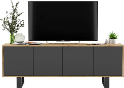 A TV stand with a television on top, and decorative items on the side.