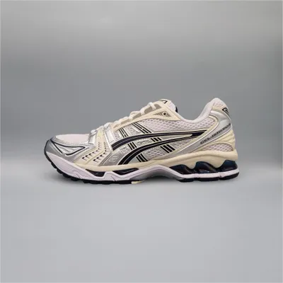 A side view of a single Asics GEL-Kayano 14 sneaker against a plain gray background.