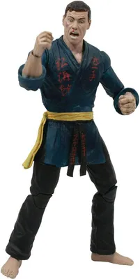 A full-body shot of an action figure of Jean-Claude Van Damme in a martial arts pose.