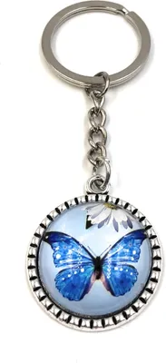 Produktbild von Onwomania Schlüsselanhänger Schmetterling fliegend blau Kreis Metall Anhänger Charm
