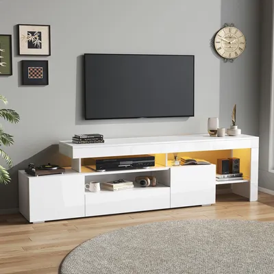 A modern living room with a TV stand and television.