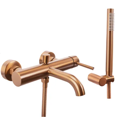 A close-up studio shot of a brushed copper bathtub faucet with a handheld showerhead.