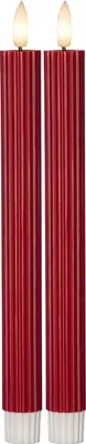 Two red LED taper candles with white bases and illuminated tops, presented against a white background.