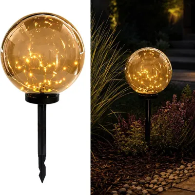 Obrázek produktu pro LUMILED Solární zahradní lampa LED, koule, kouřově šedá, 30 cm. Solární lampa, osvětlení cesty, model GLORIS, IP44. Solární koule pro zahradu, venkovní použití. Svítící koule, 3000K, teplá bílá, kouřová barva, s kolíkem pro zapíchnutí do země. Venkovní osvětlení, osvětlení cesty