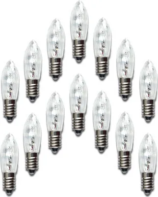 A collection of clear, small light bulbs with silver bases arranged in rows on a white background.