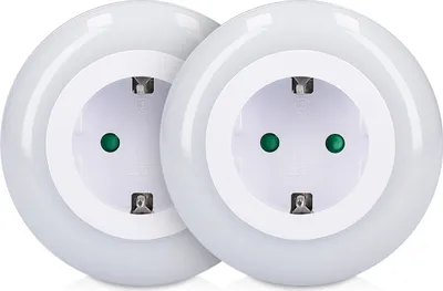 Two white circular LED night light plug-in adapters are shown side-by-side against a white background.