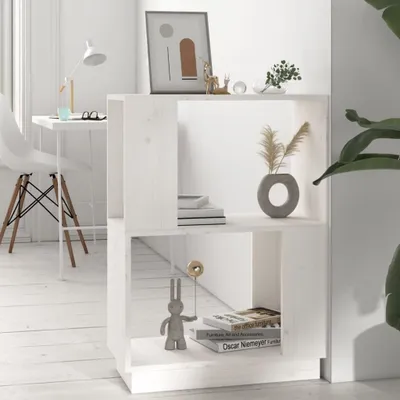 A white wooden bookshelf with books and decorative items on it, placed in a room with white wooden floors and a white chair and desk in the background.