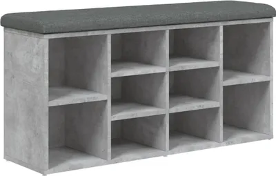 A shoe bench with multiple compartments and a padded top.