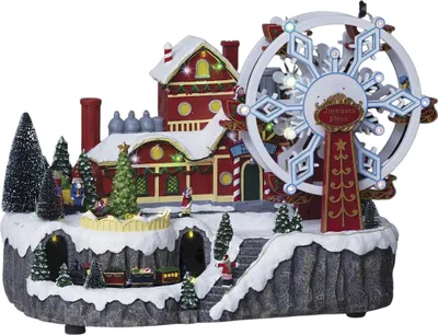 A festive Christmas village scene with a Ferris wheel and a train.