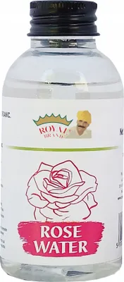 A bottle of rose water with a label showing a rose and a man in traditional attire.